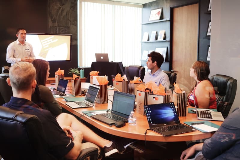 Meeting around a table with laptops