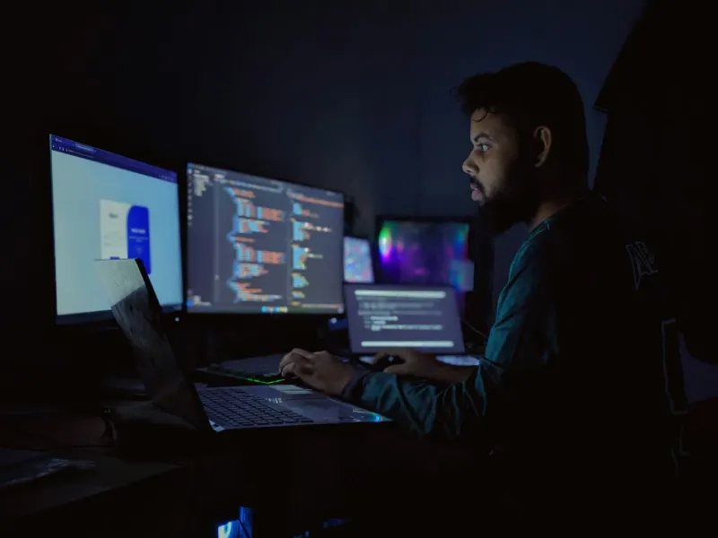 An operator monitoring systems on screen while on call